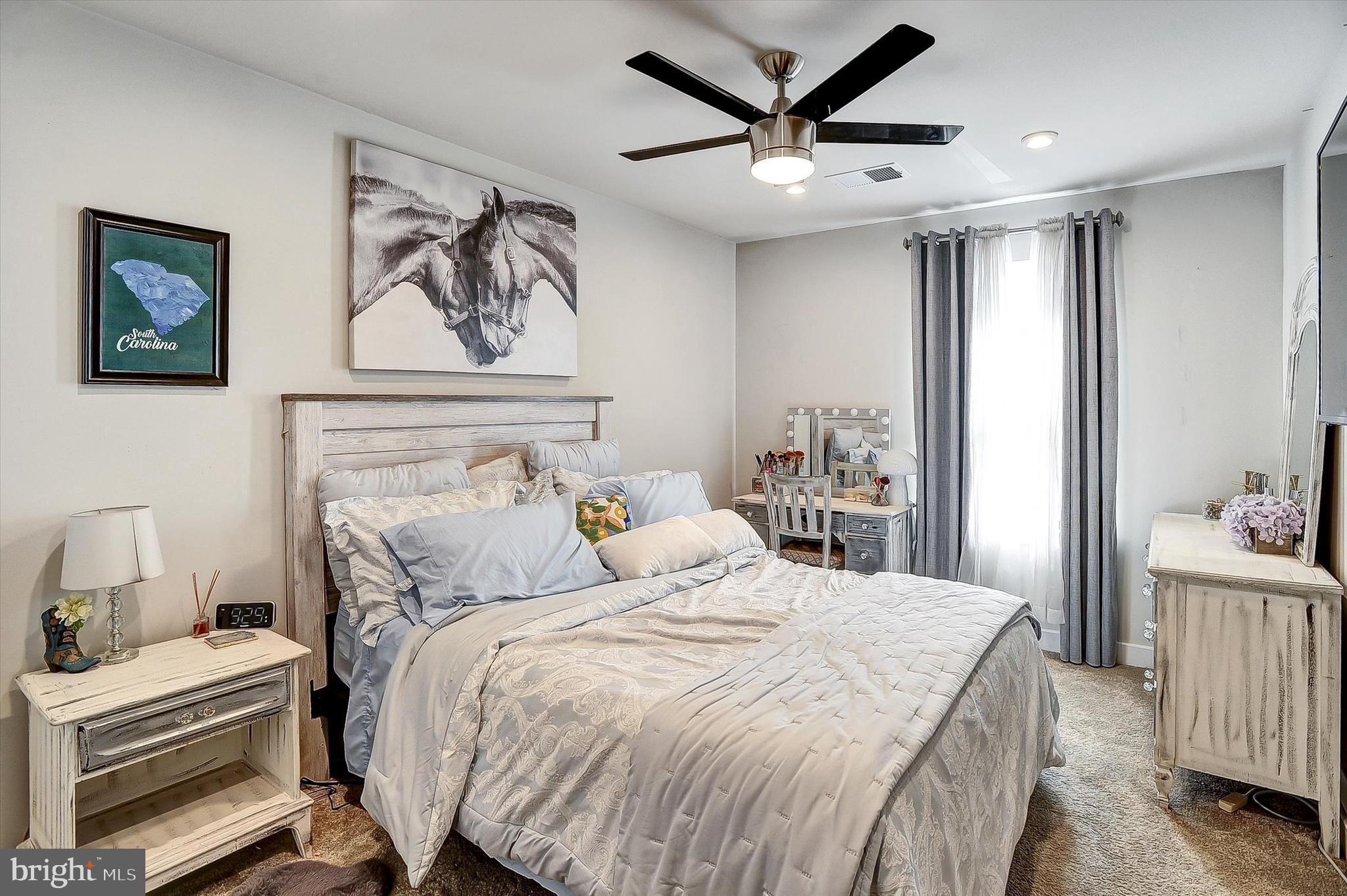 739 Cascade Way Kennett Square, PA 19348 - Photo 26 of 76 a bedroom with a large bed and a chandelier