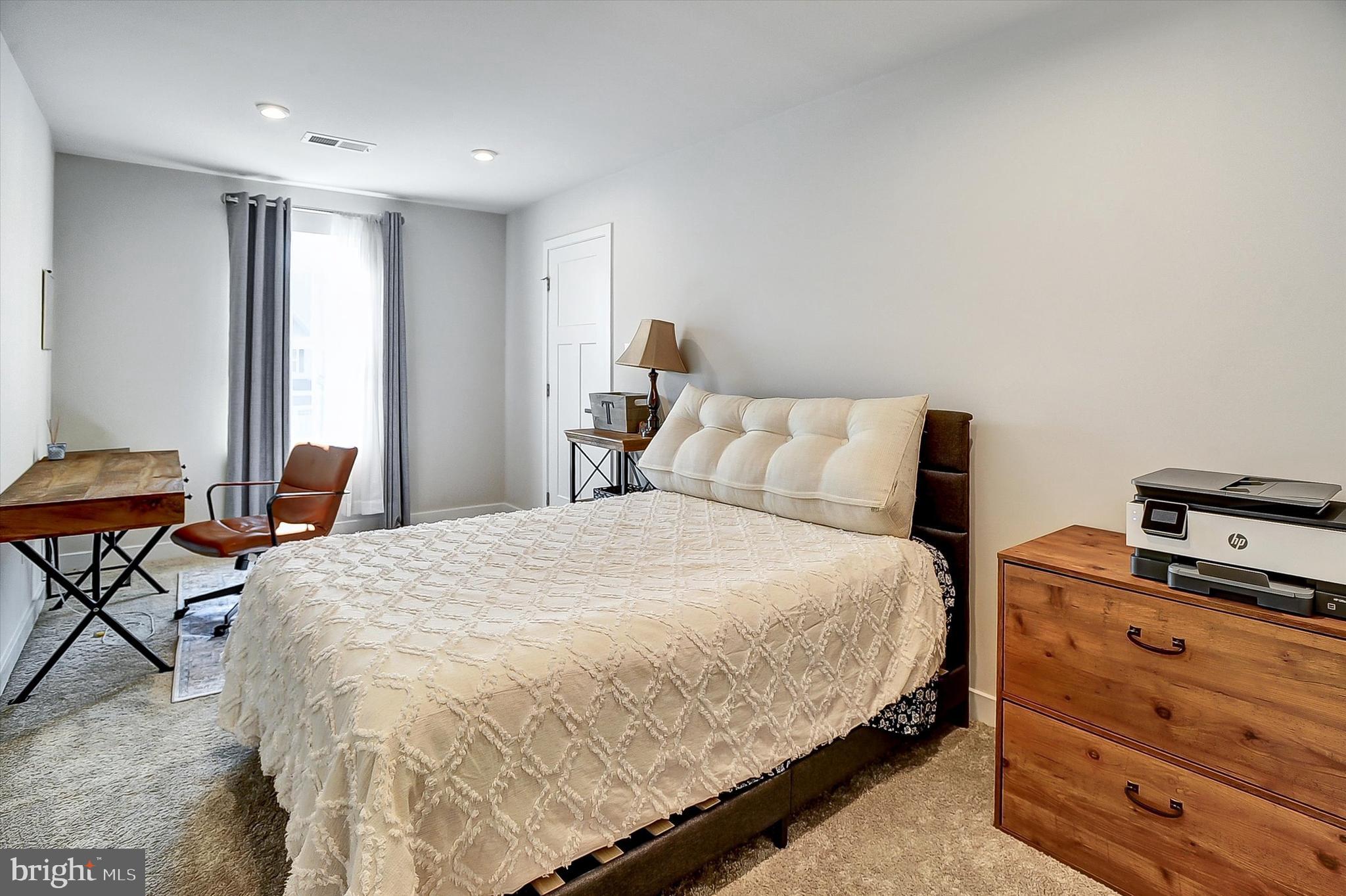 739 Cascade Way Kennett Square, PA 19348 - Photo 27 of 76 a bedroom with a bed and a window