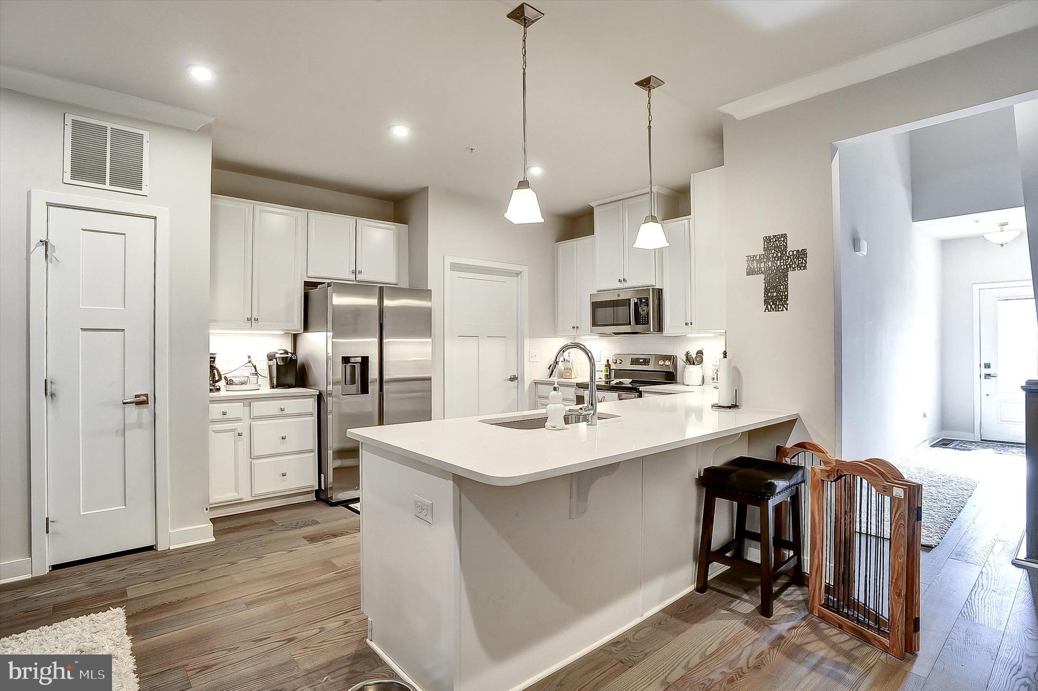 739 Cascade Way Kennett Square, PA 19348 - Photo 4 of 76 a kitchen with a sink stainless steel appliances and cabinets
