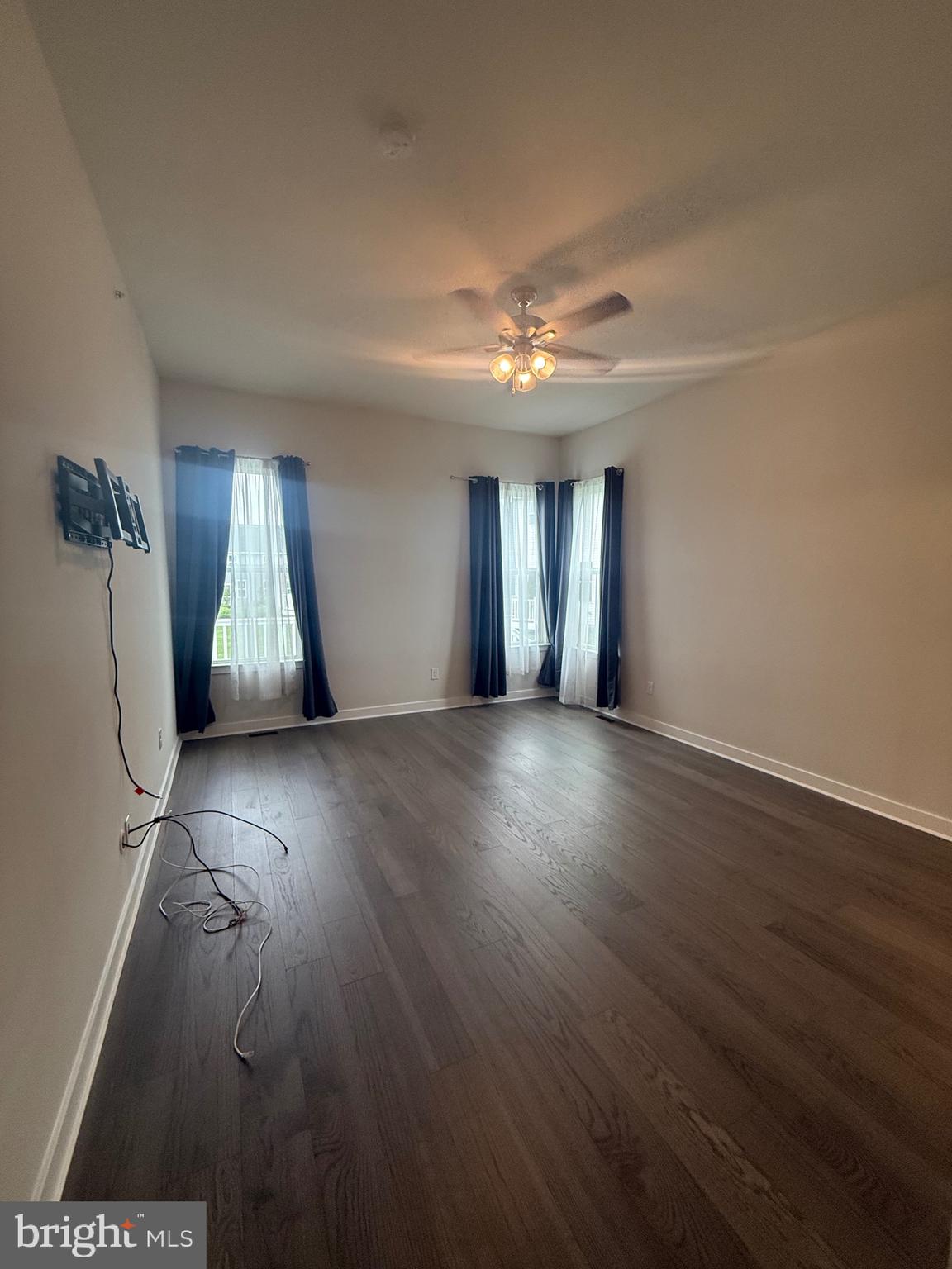 739 Cascade Way Kennett Square, PA 19348 - Photo 47 of 76 a view of an empty room with wooden floor and a window