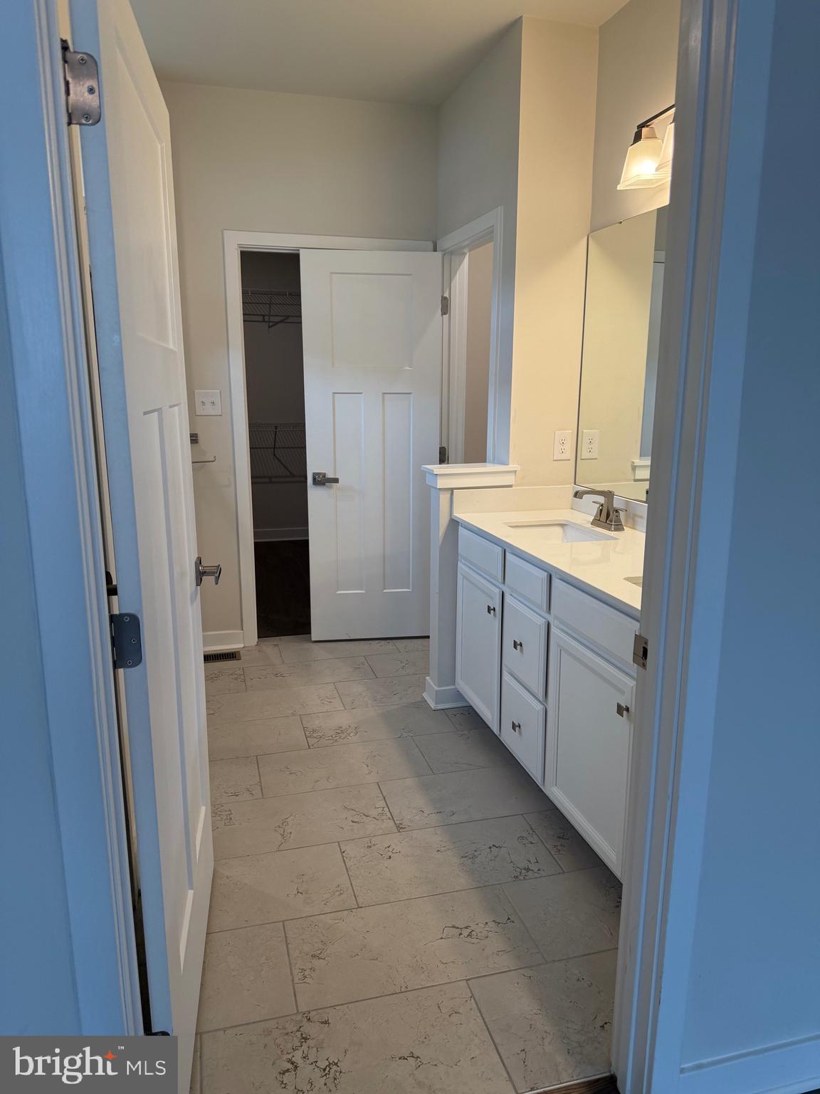 739 Cascade Way Kennett Square, PA 19348 - Photo 48 of 76 a bathroom with a granite countertop sink a mirror and a bathtub