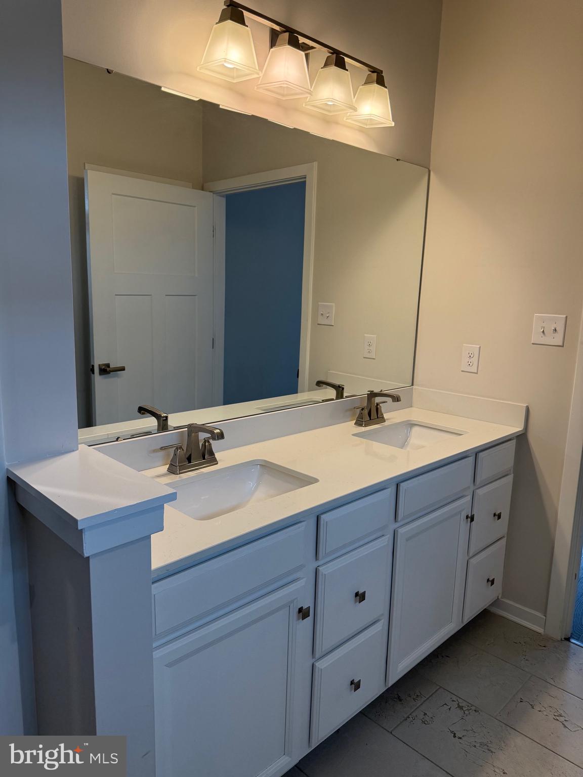 739 Cascade Way Kennett Square, PA 19348 - Photo 50 of 76 a bathroom with a sink and a mirror