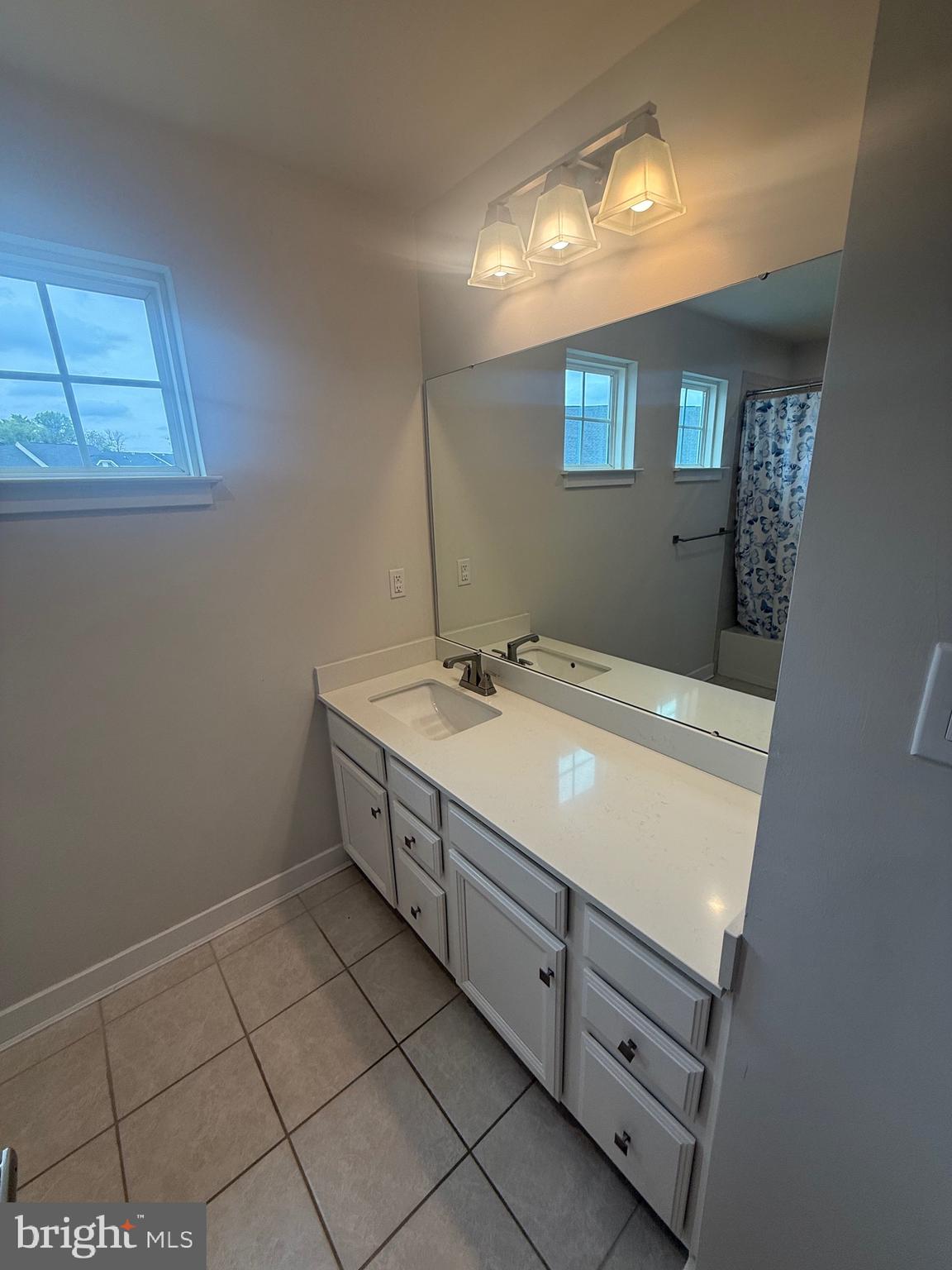 739 Cascade Way Kennett Square, PA 19348 - Photo 66 of 76 a bathroom with a sink and a mirror