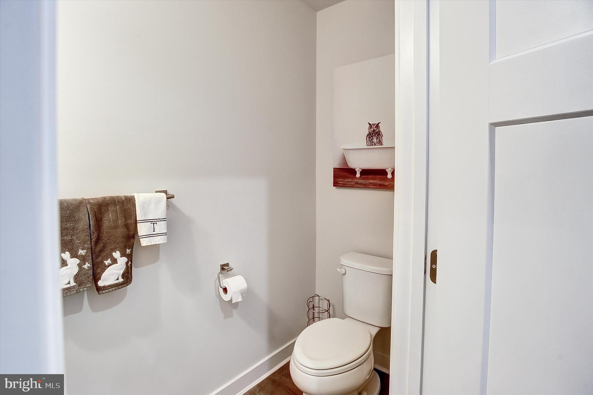 739 Cascade Way Kennett Square, PA 19348 - Photo 9 of 76 a white toilet sitting next to a bathroom sink
