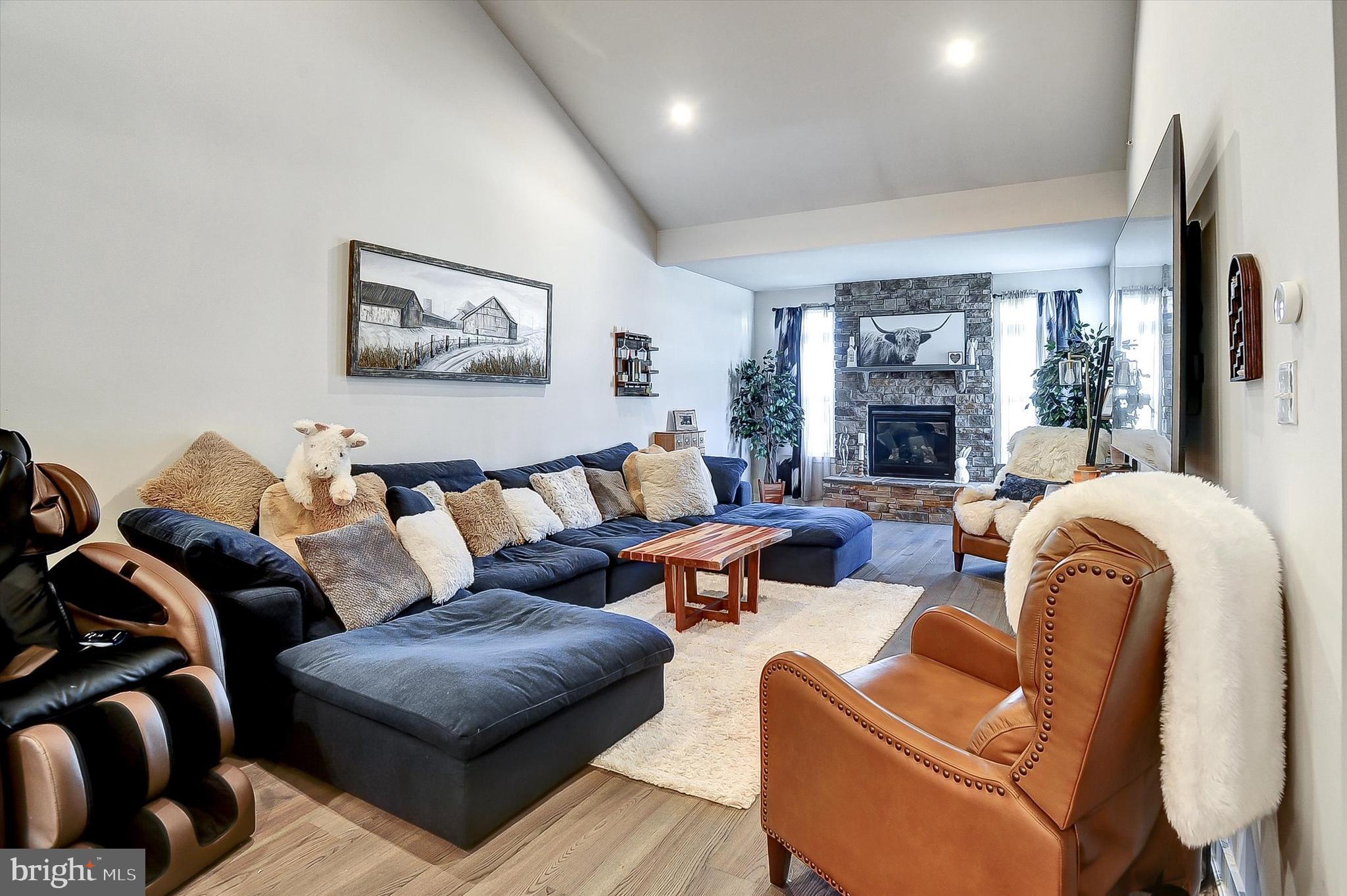739 Cascade Way Kennett Square, PA 19348 - Photo 10 of 76 a living room with furniture fireplace and a large window