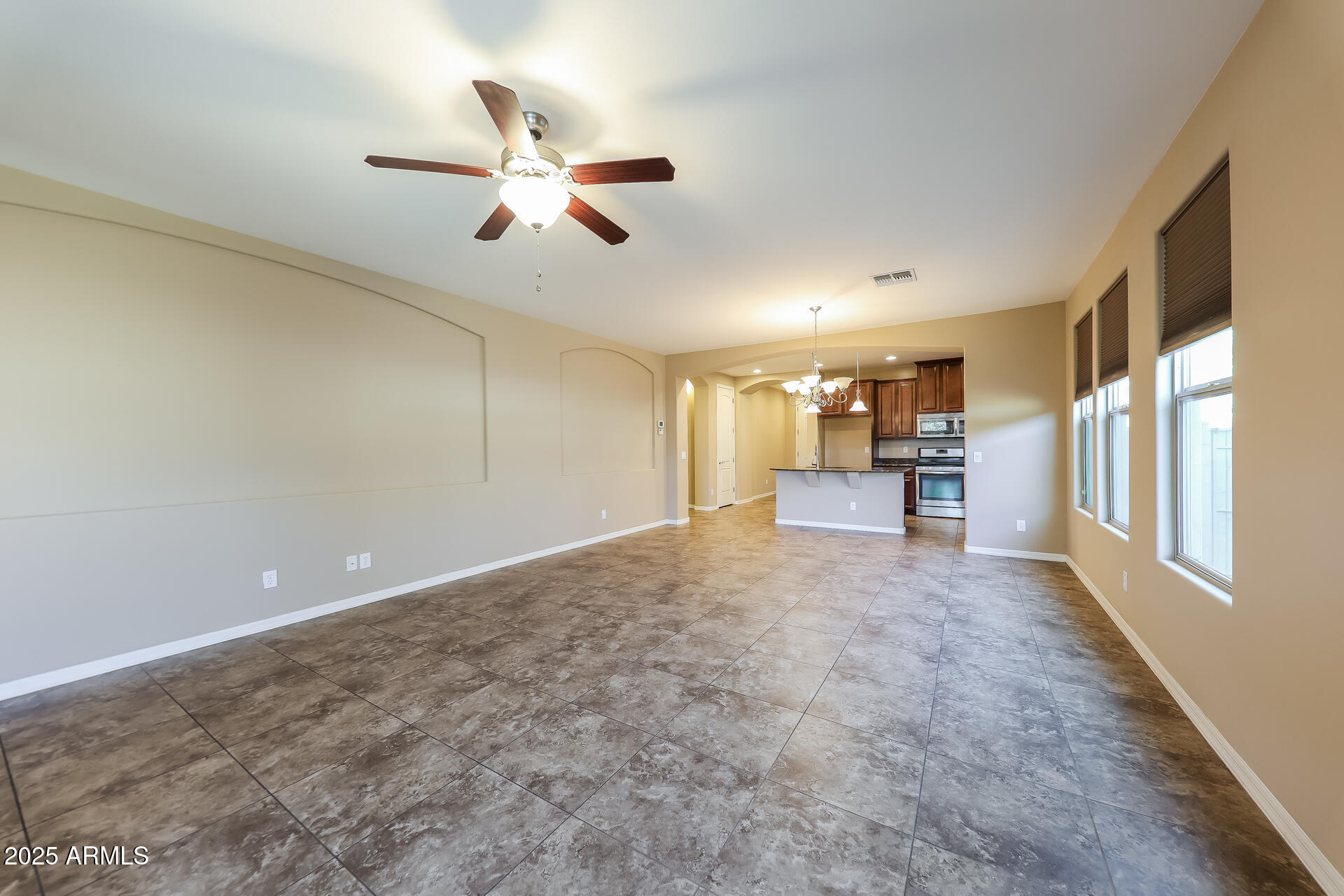 20693 West Ridge Road Buckeye, AZ 85396 - Photo 2 of 16 a view of a livingroom with a ceiling fan and window