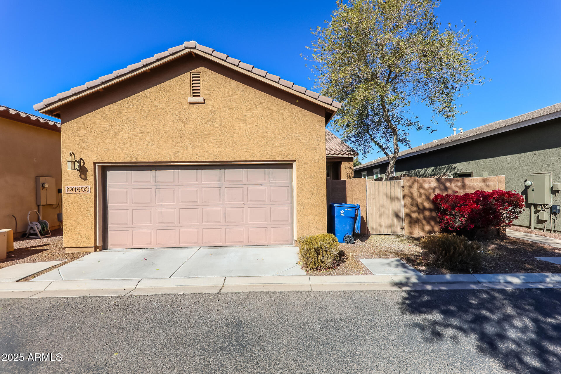 20693 West Ridge Road Buckeye, AZ 85396 - Photo 6 of 16 a front view of a house with a garage