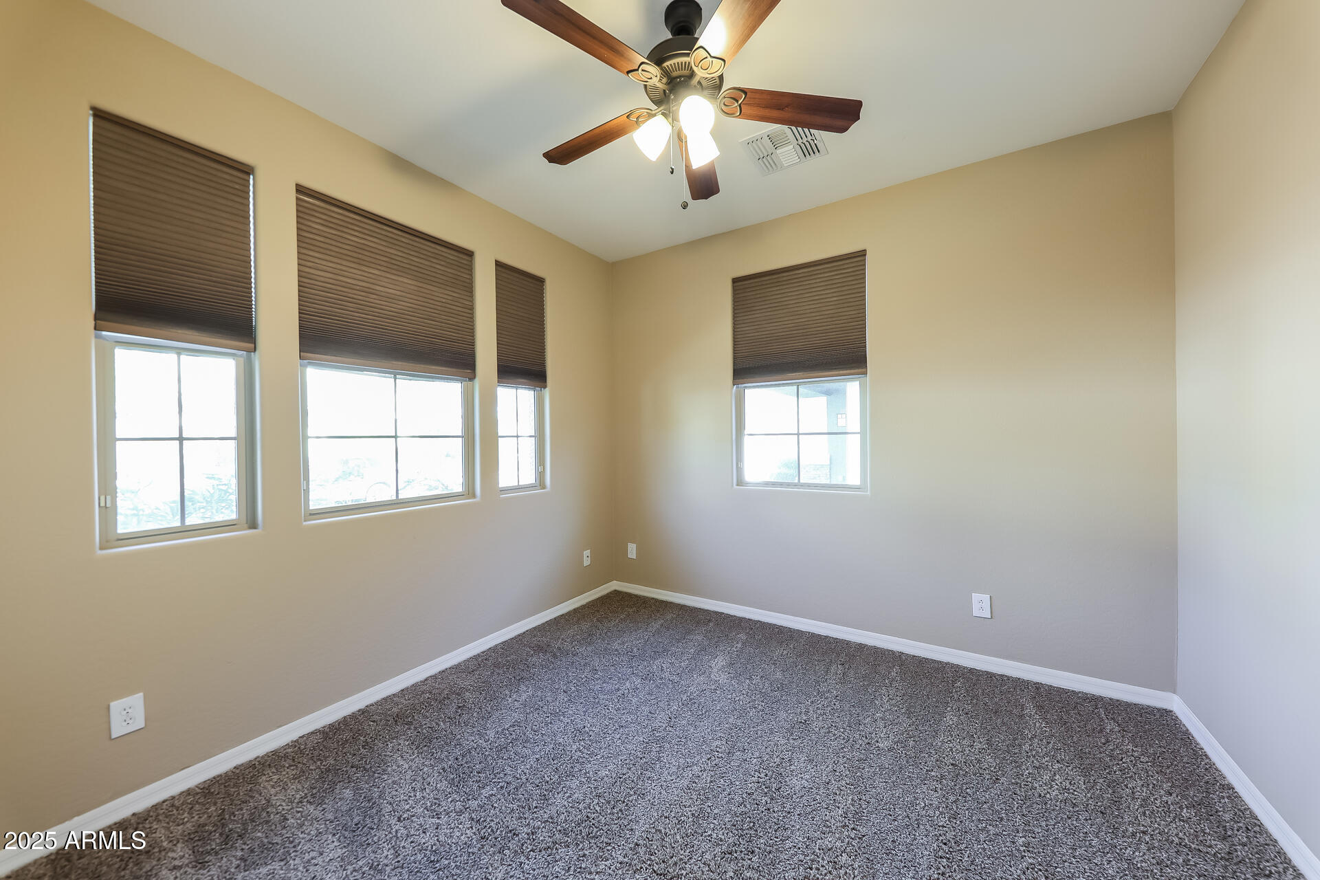 20693 West Ridge Road Buckeye, AZ 85396 - Photo 9 of 16 a view of a livingroom with a ceiling fan and window