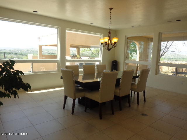274 Camino Panama Rio Rico, AZ 85648 - Photo 8 of 23 a view of a dining room with furniture window and outside view
