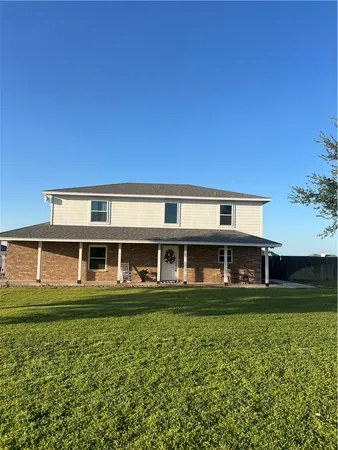 front view of a building with a yard