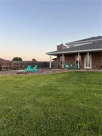 a front view of building with yard