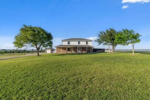 a view of a house with a big yard