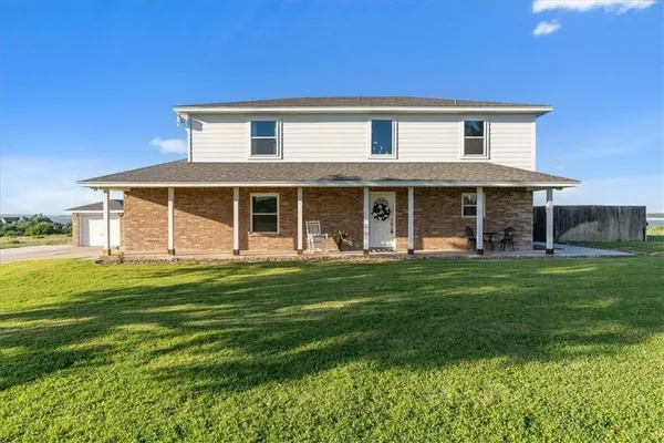 front view of a house with a yard