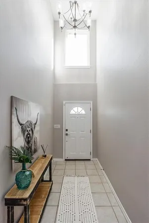 a view of a hallway with a potted plant