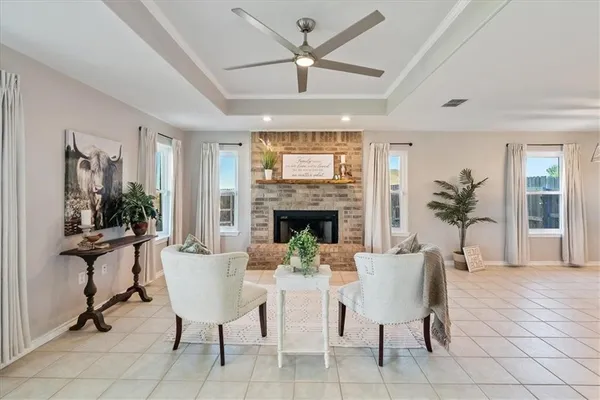 a view of a livingroom with furniture window and wooden floor