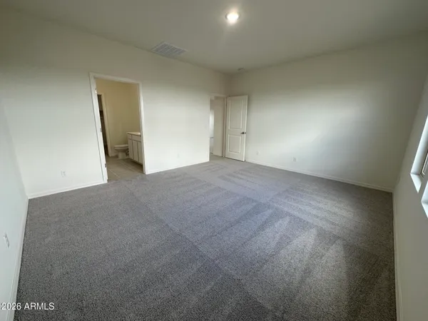 a view of an empty room and a window