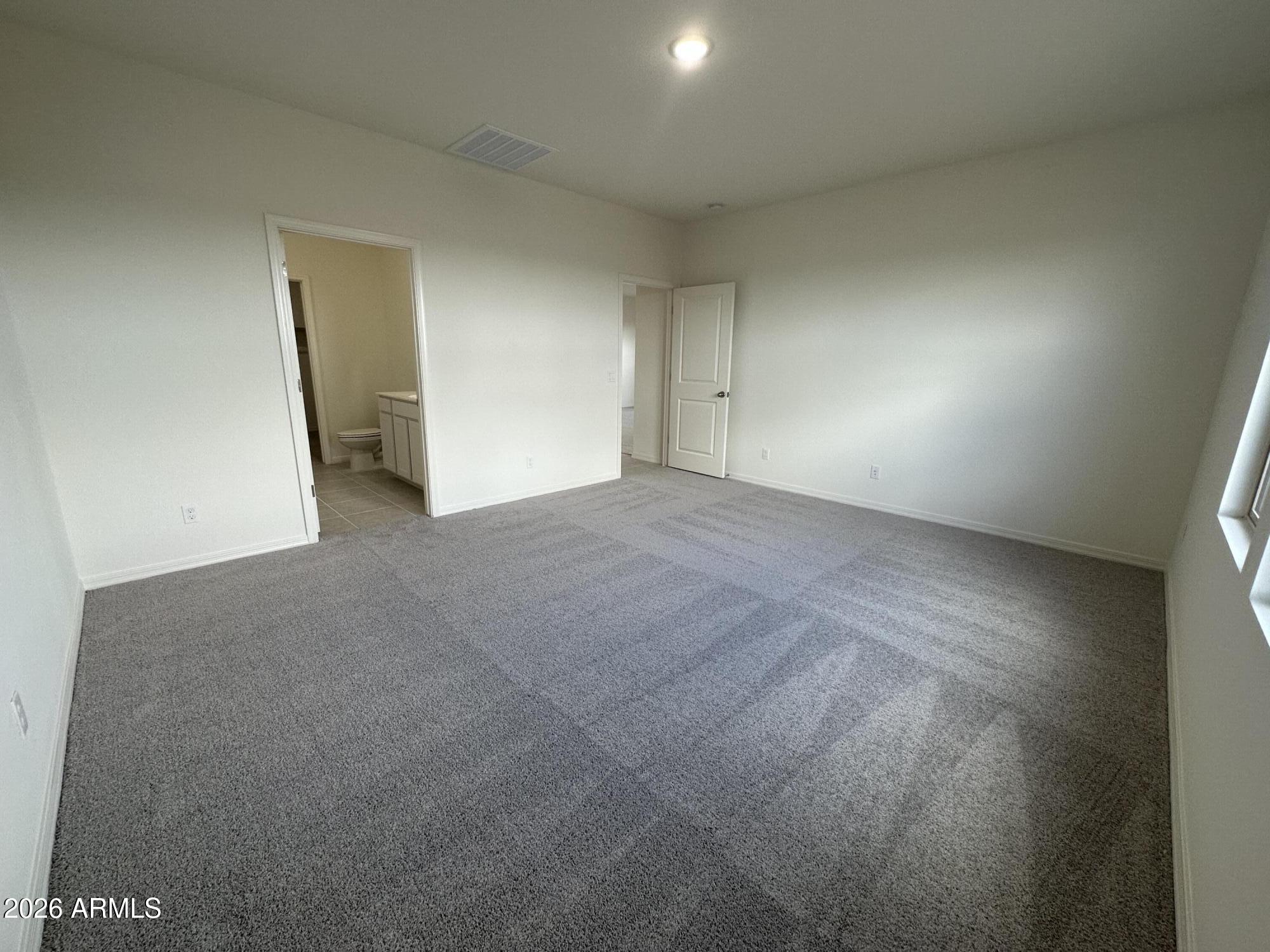 2164 Night Rider Road San Tan Valley, AZ 85140 - Photo 6 of 12 a view of an empty room and a window