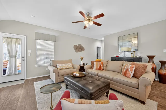 a living room with furniture and a large window