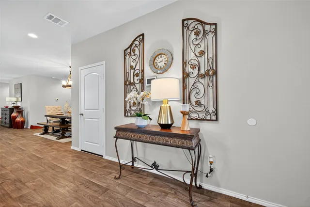 a view of a hallway with seating area
