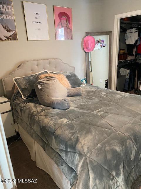 866 East Millenium Court Tucson, AZ 85719 - Photo 10 of 15 a bed sitting in a bedroom next to a window