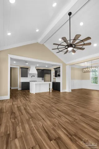 a kitchen with stainless steel appliances granite countertop wooden cabinets a sink and a stove