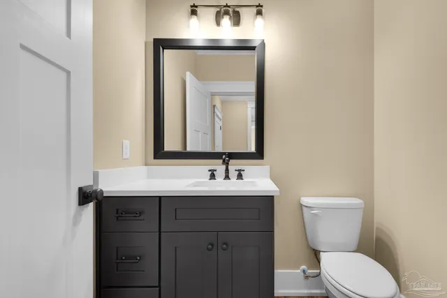 a view of swimming pool with lounge chair in front of house