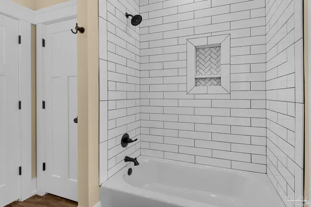 a view of a swimming pool with furniture