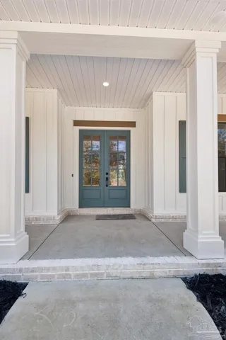 a view of a hallway with a glass door