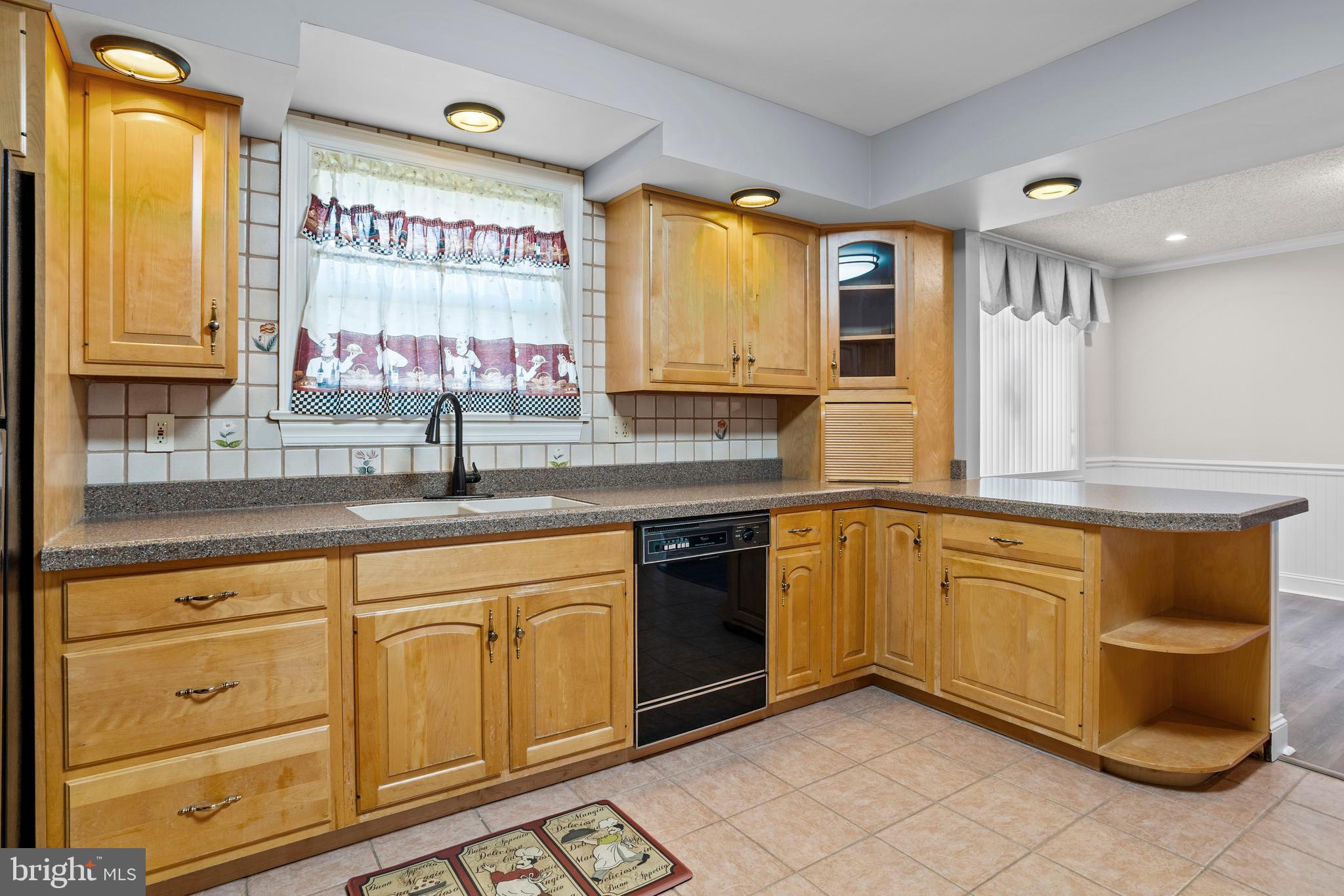 311 Ogden Place Springfield, PA 19064 - Photo 13 of 35 a kitchen with stainless steel appliances granite countertop a sink and cabinets