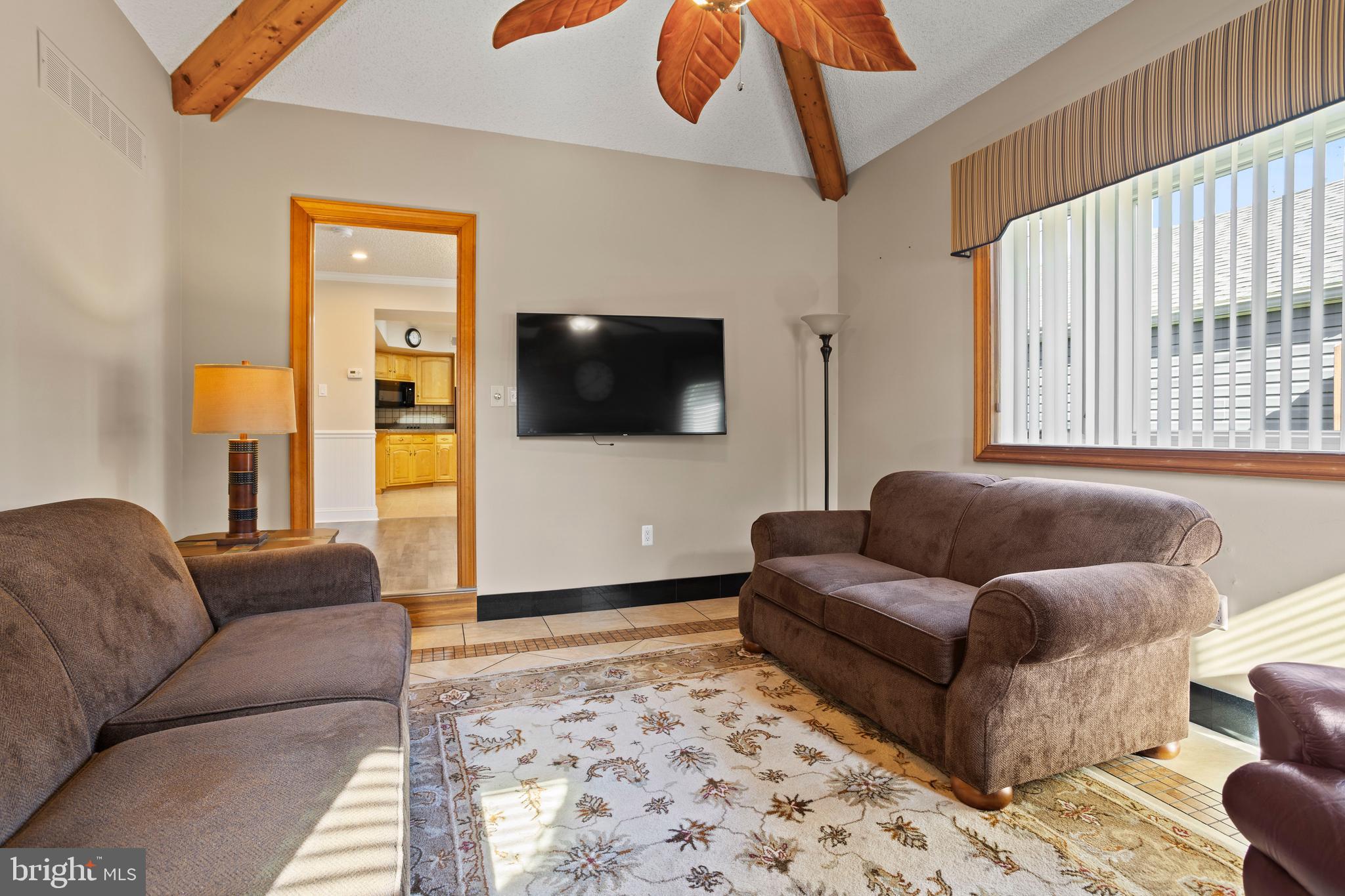 311 Ogden Place Springfield, PA 19064 - Photo 16 of 35 a living room with furniture and a flat screen tv