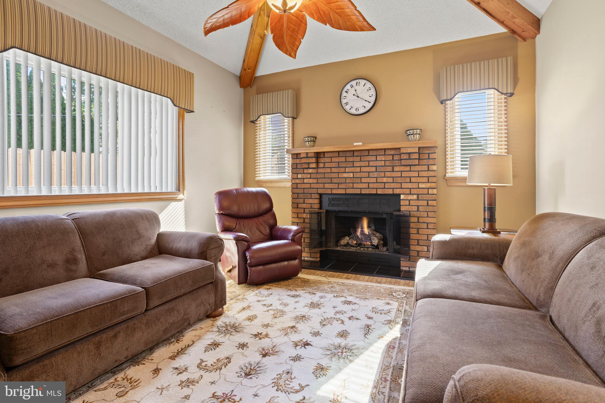 311 Ogden Place Springfield, PA 19064 - Photo 17 of 35 a living room with furniture and a fireplace