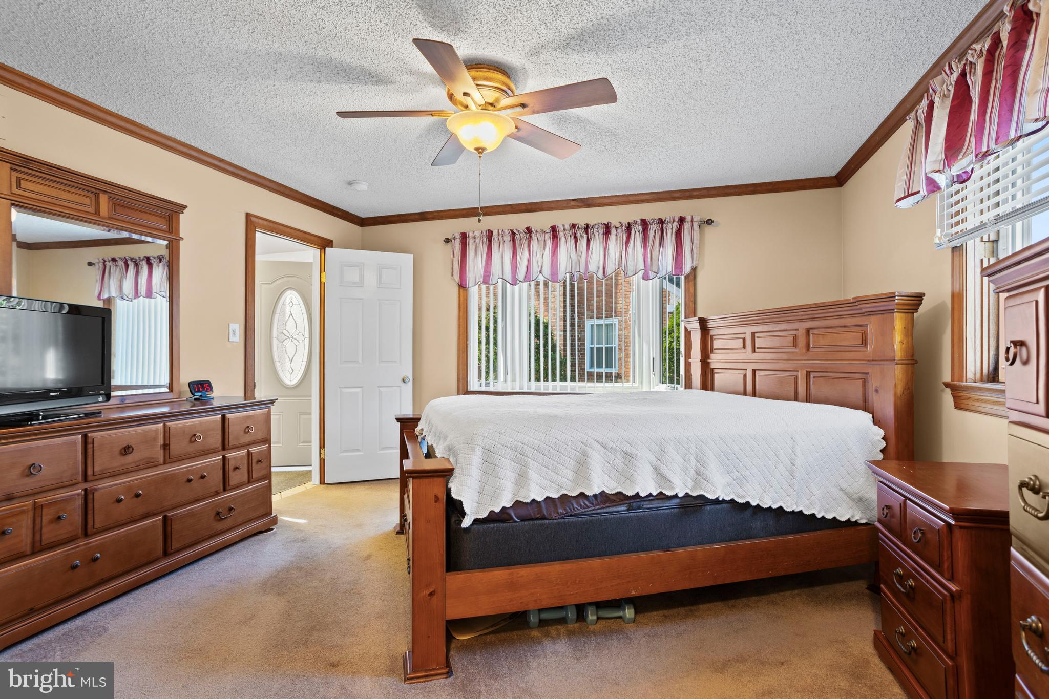 311 Ogden Place Springfield, PA 19064 - Photo 20 of 35 a bed sitting in a bedroom next to a window with a flat screen tv
