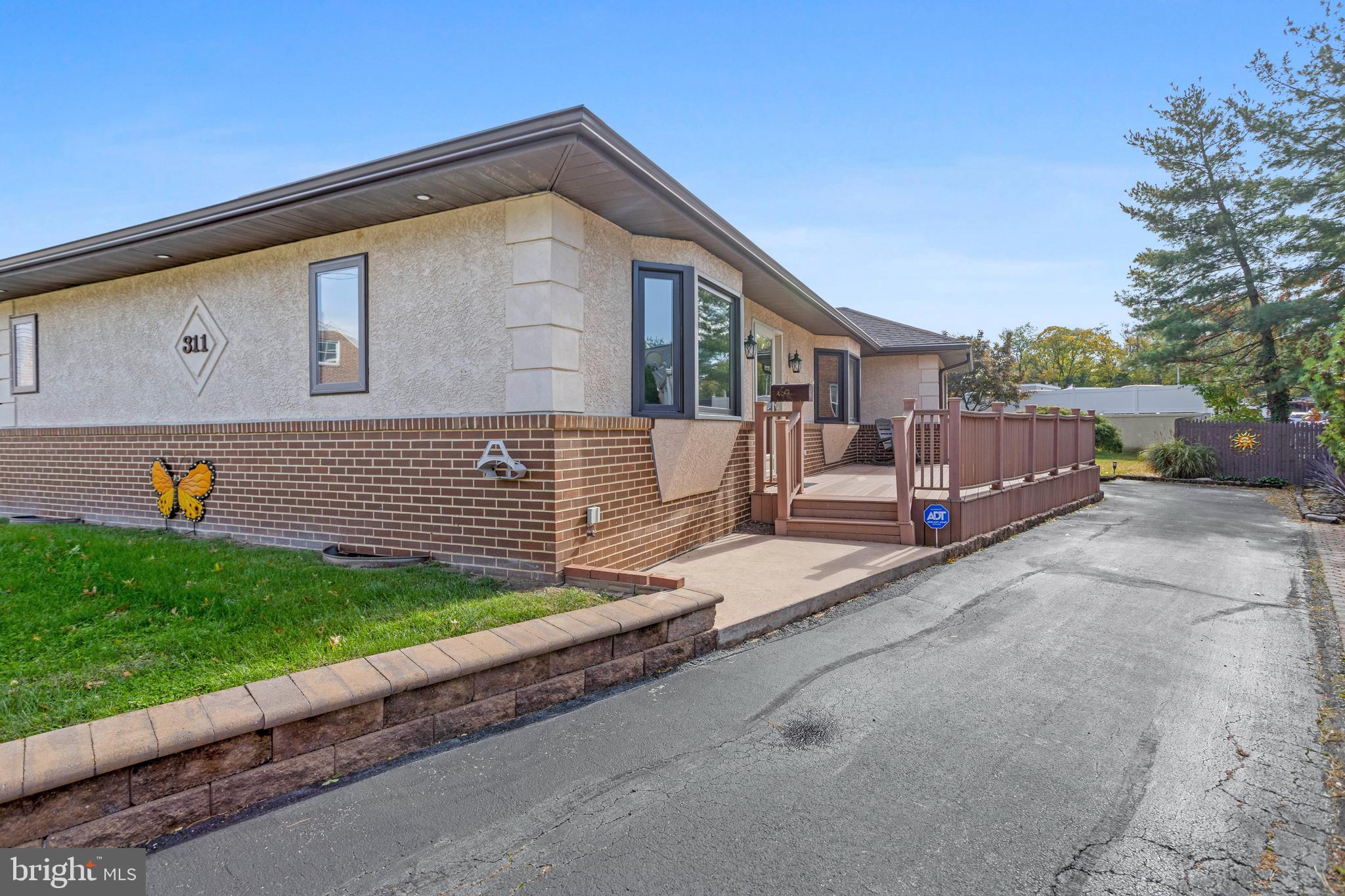 311 Ogden Place Springfield, PA 19064 - Photo 2 of 35 a front view of a house with a yard