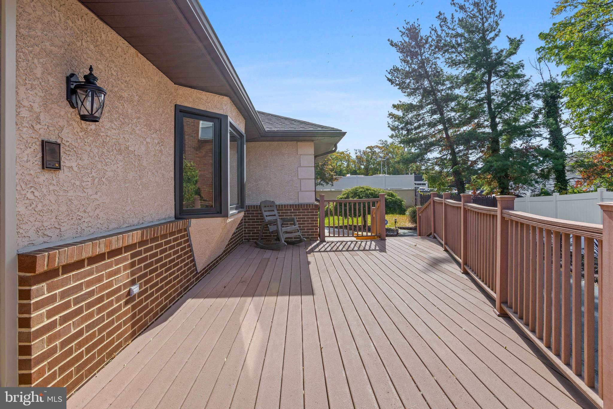 311 Ogden Place Springfield, PA 19064 - Photo 30 of 35 a view of balcony with deck and wooden floor