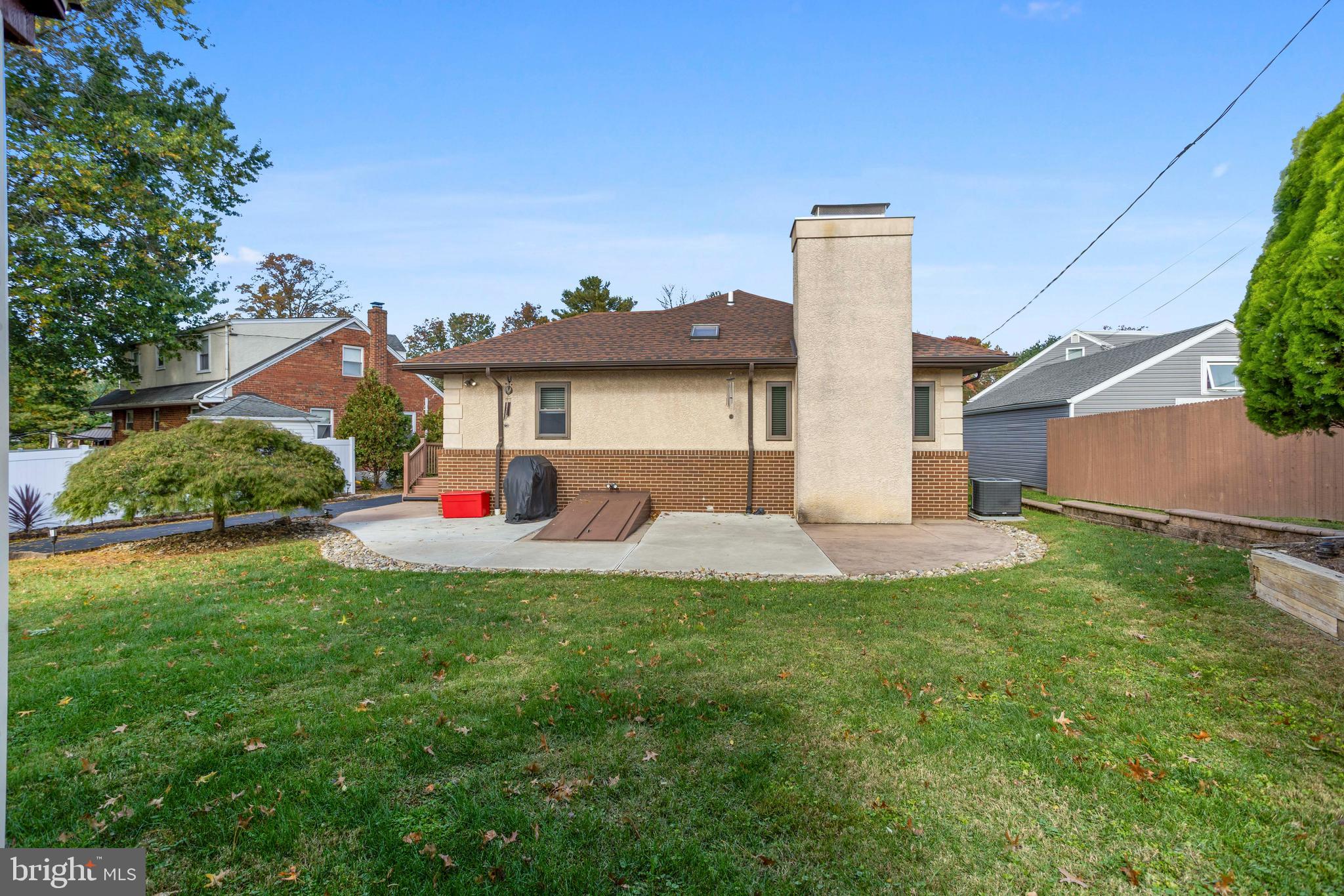 311 Ogden Place Springfield, PA 19064 - Photo 32 of 35 a front view of a house with a yard and garage