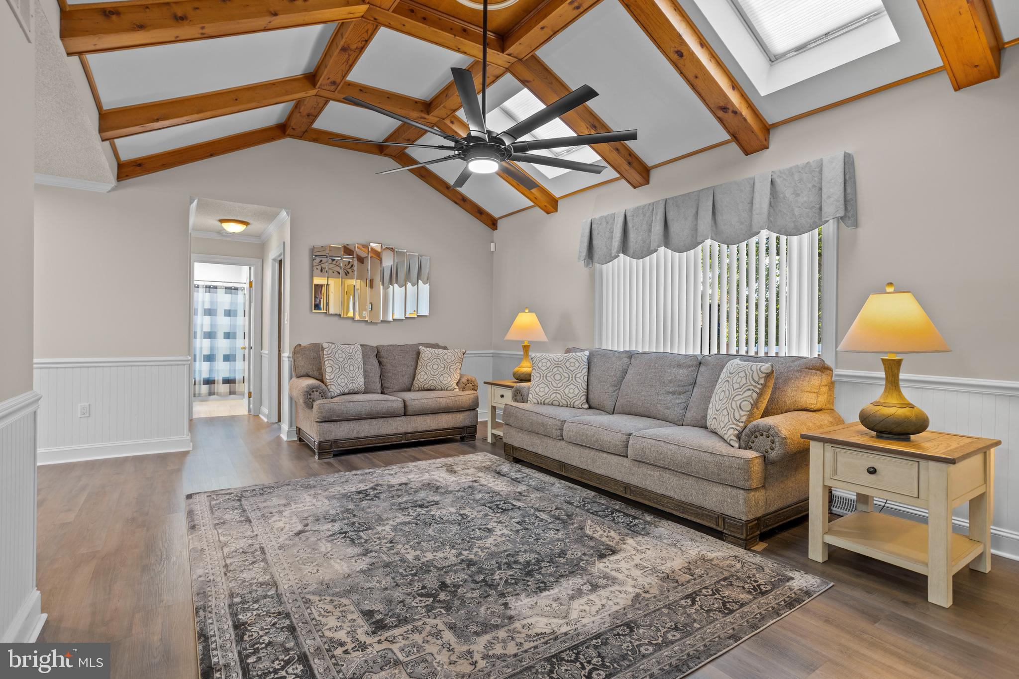 311 Ogden Place Springfield, PA 19064 - Photo 6 of 35 a living room with furniture and a chandelier