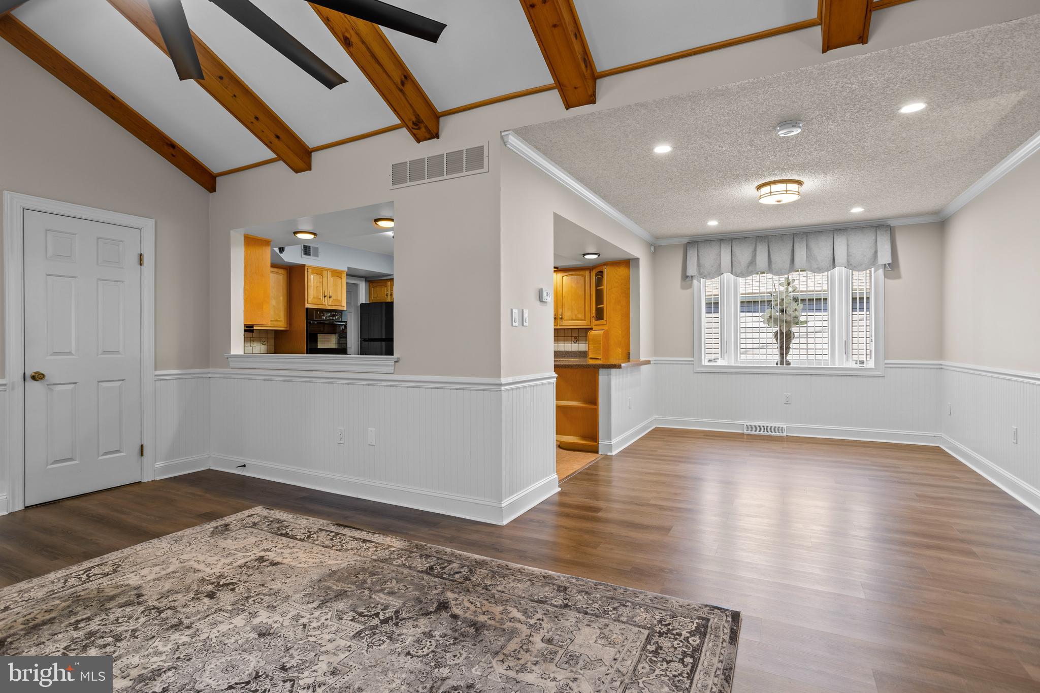 311 Ogden Place Springfield, PA 19064 - Photo 7 of 35 a view of an empty room with a window and wooden floor