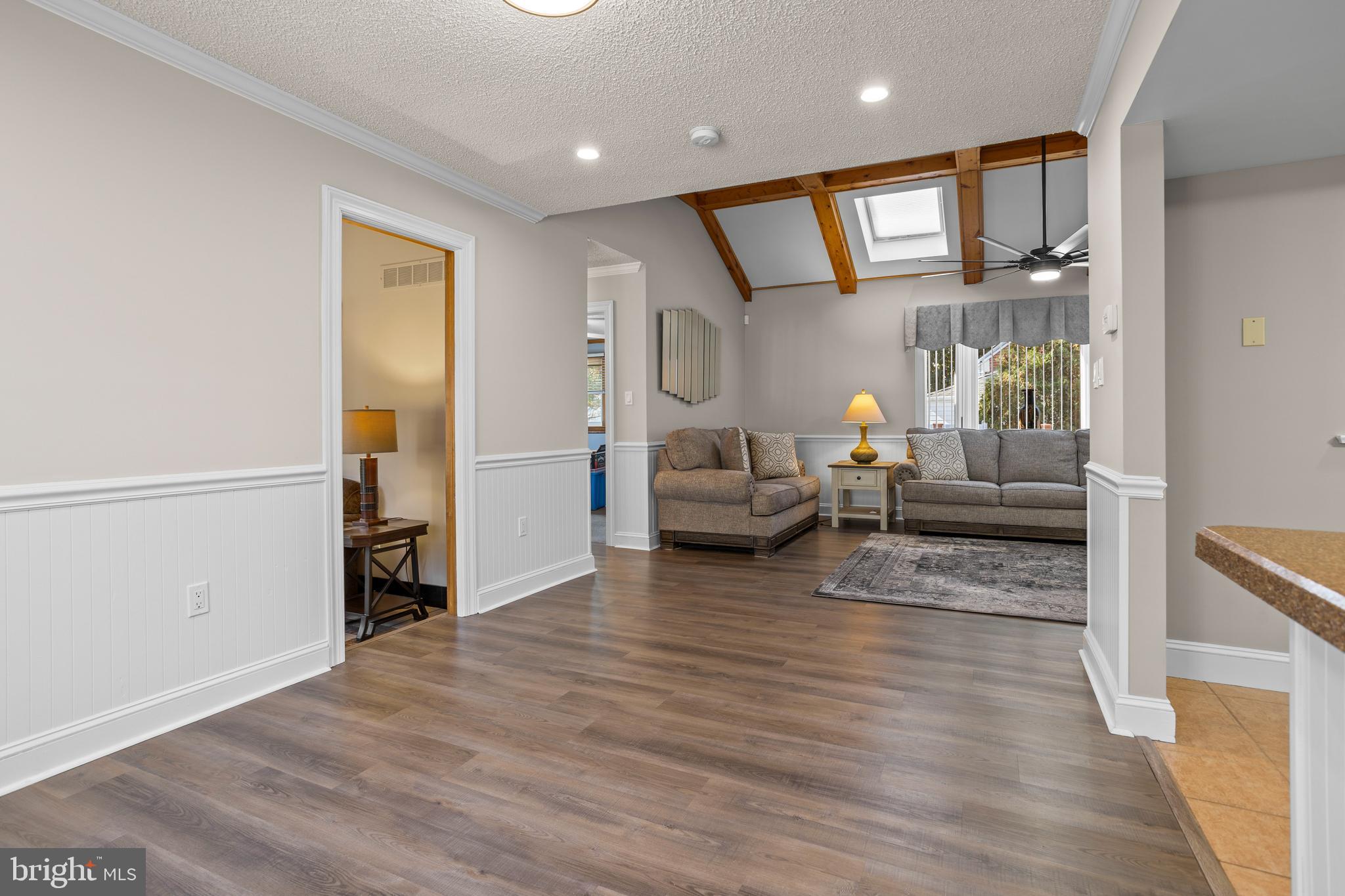 311 Ogden Place Springfield, PA 19064 - Photo 8 of 35 a living room with furniture and a wooden floor