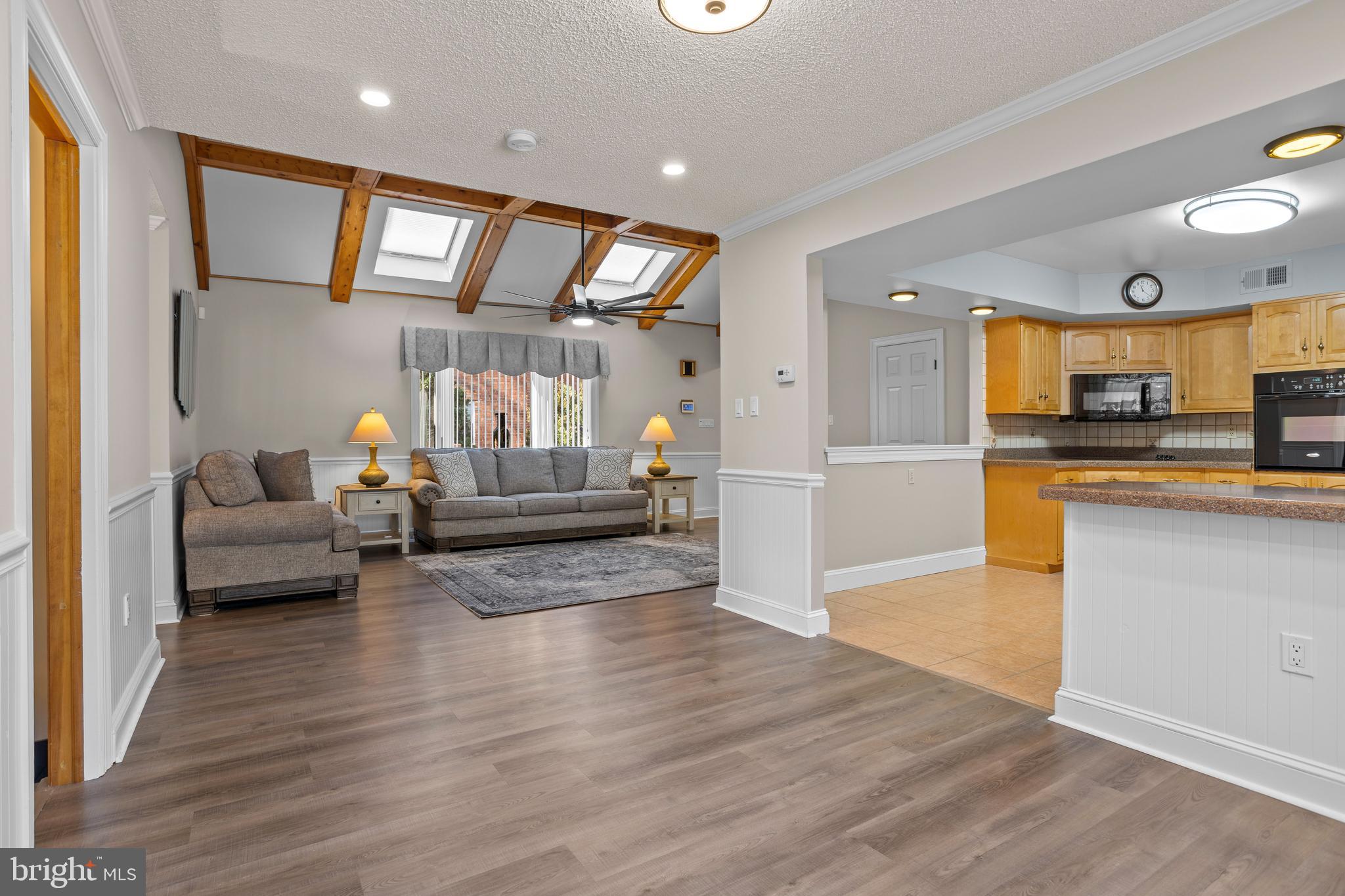 311 Ogden Place Springfield, PA 19064 - Photo 9 of 35 a living room with furniture and kitchen view