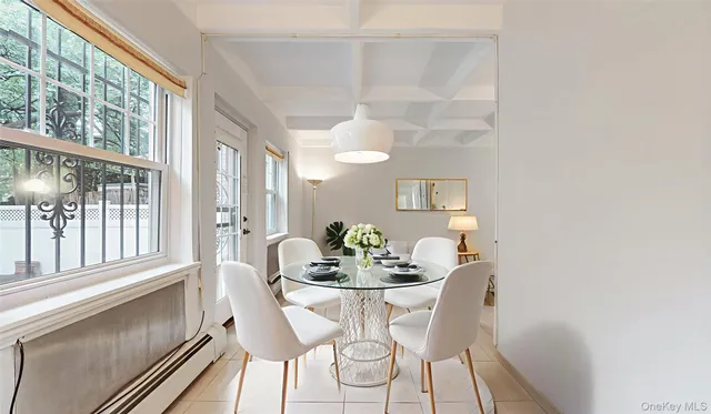 a dining room with furniture and window