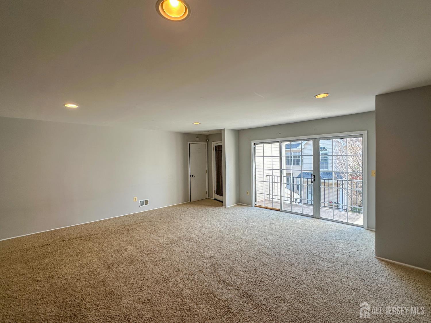 1212 Plymouth Road North Brunswick, NJ 08902 - Photo 7 of 27 a view of an empty room with a window