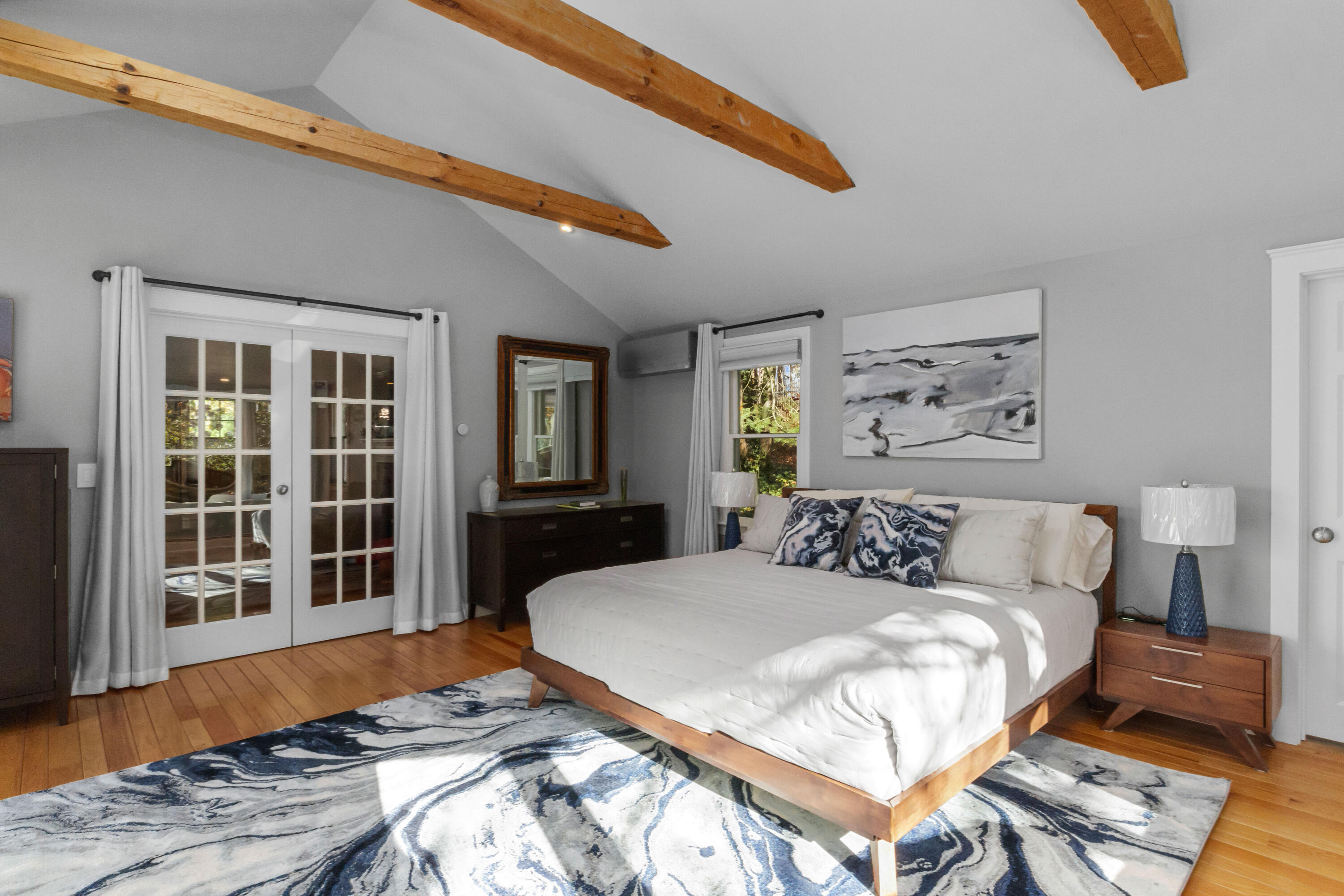 89 Namequoit Road Orleans, MA 02653 - Photo 17 of 42 a bedroom with a large bed and a window