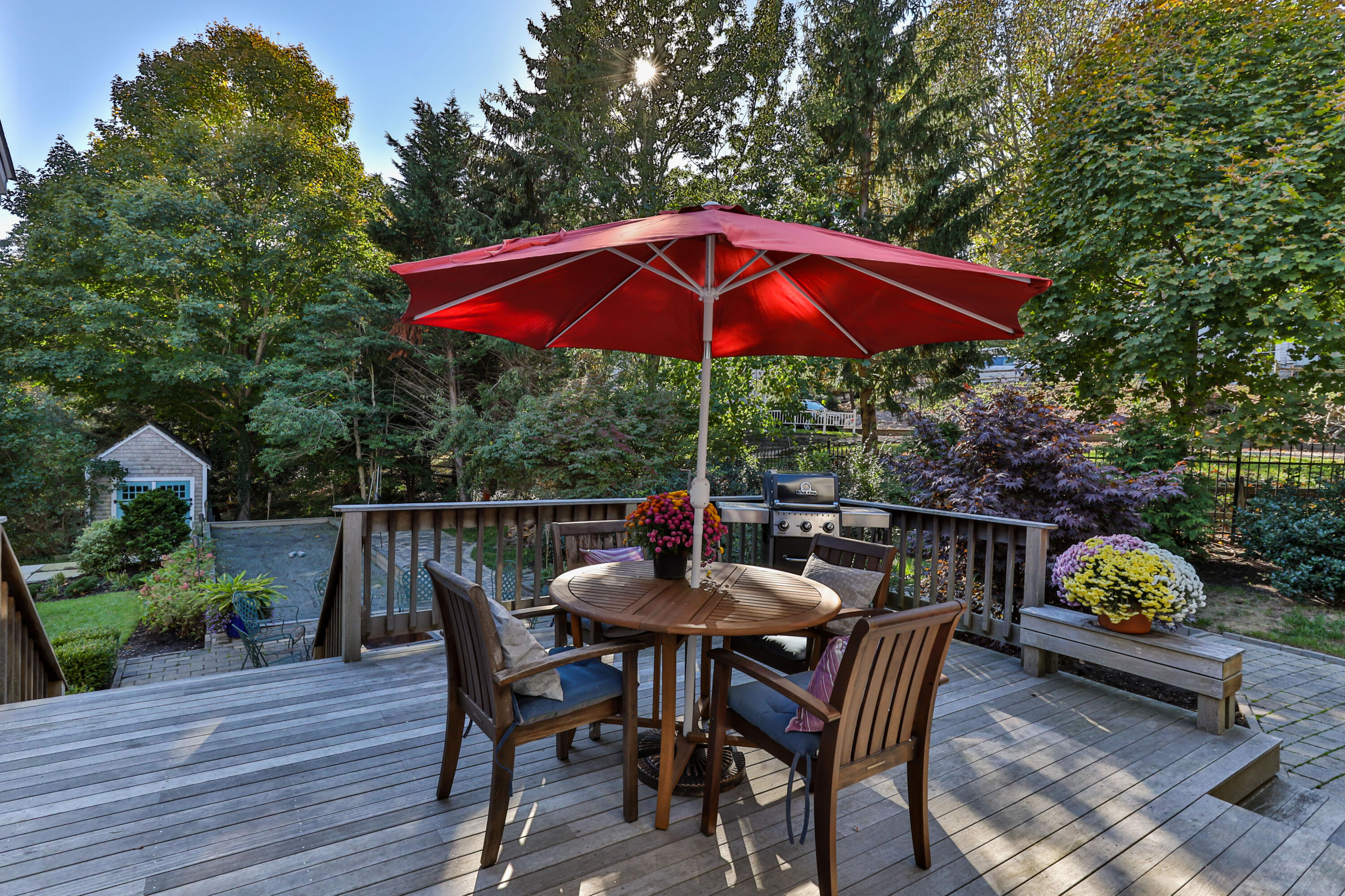 89 Namequoit Road Orleans, MA 02653 - Photo 35 of 42 a patio with wooden table and chairs