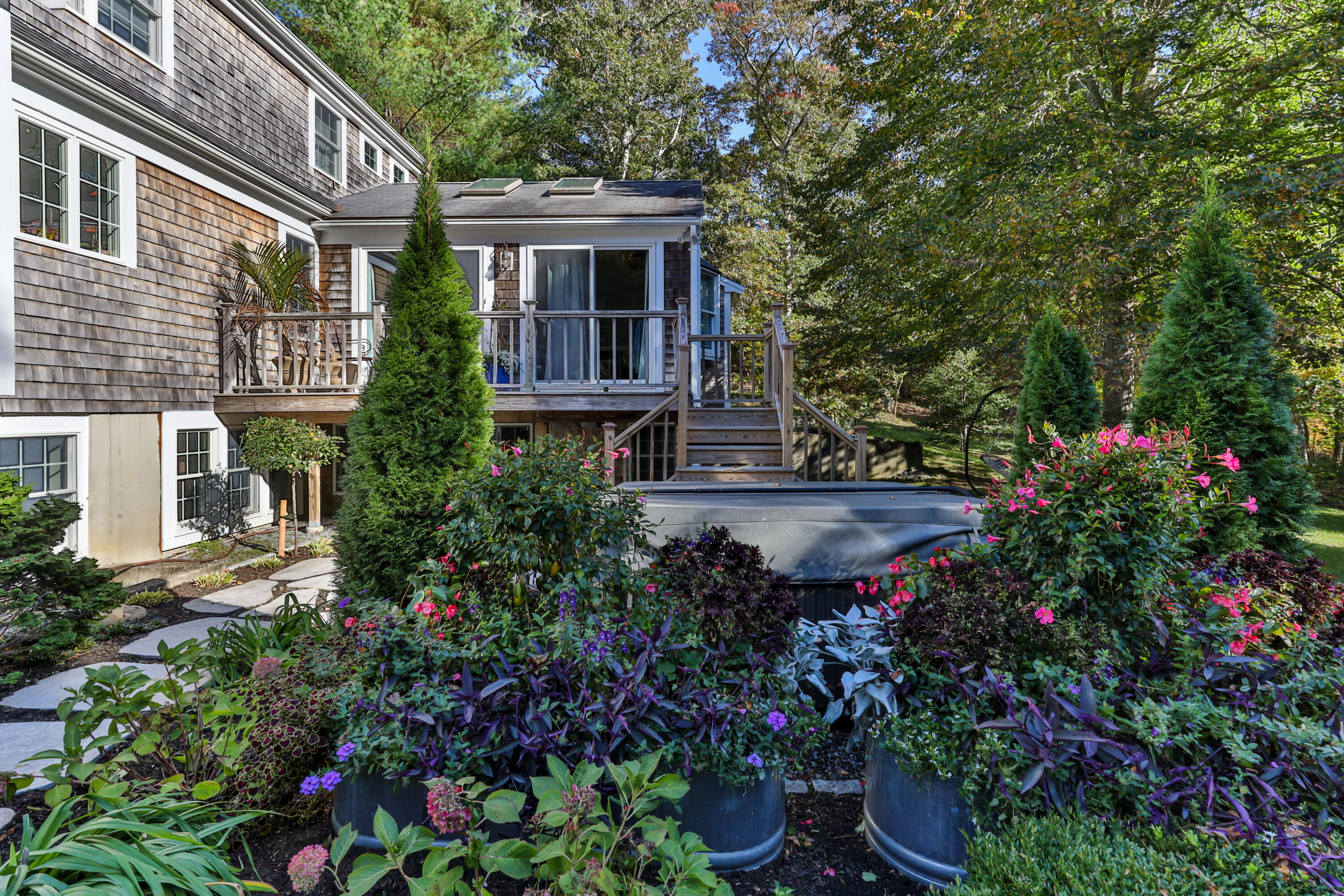 89 Namequoit Road Orleans, MA 02653 - Photo 39 of 42 a view of house with a yard and potted plants