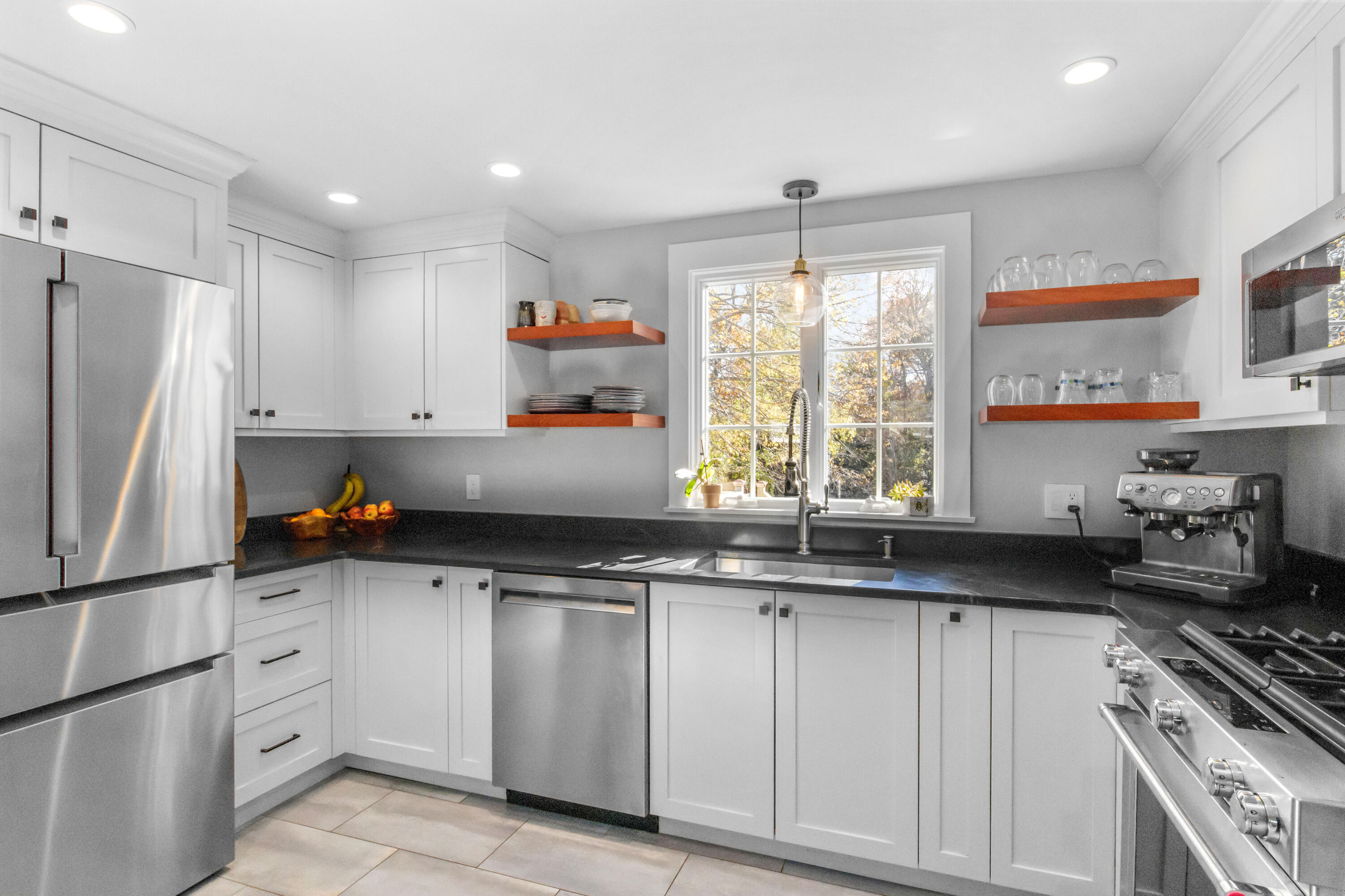 89 Namequoit Road Orleans, MA 02653 - Photo 4 of 42 a kitchen with white cabinets and a stove