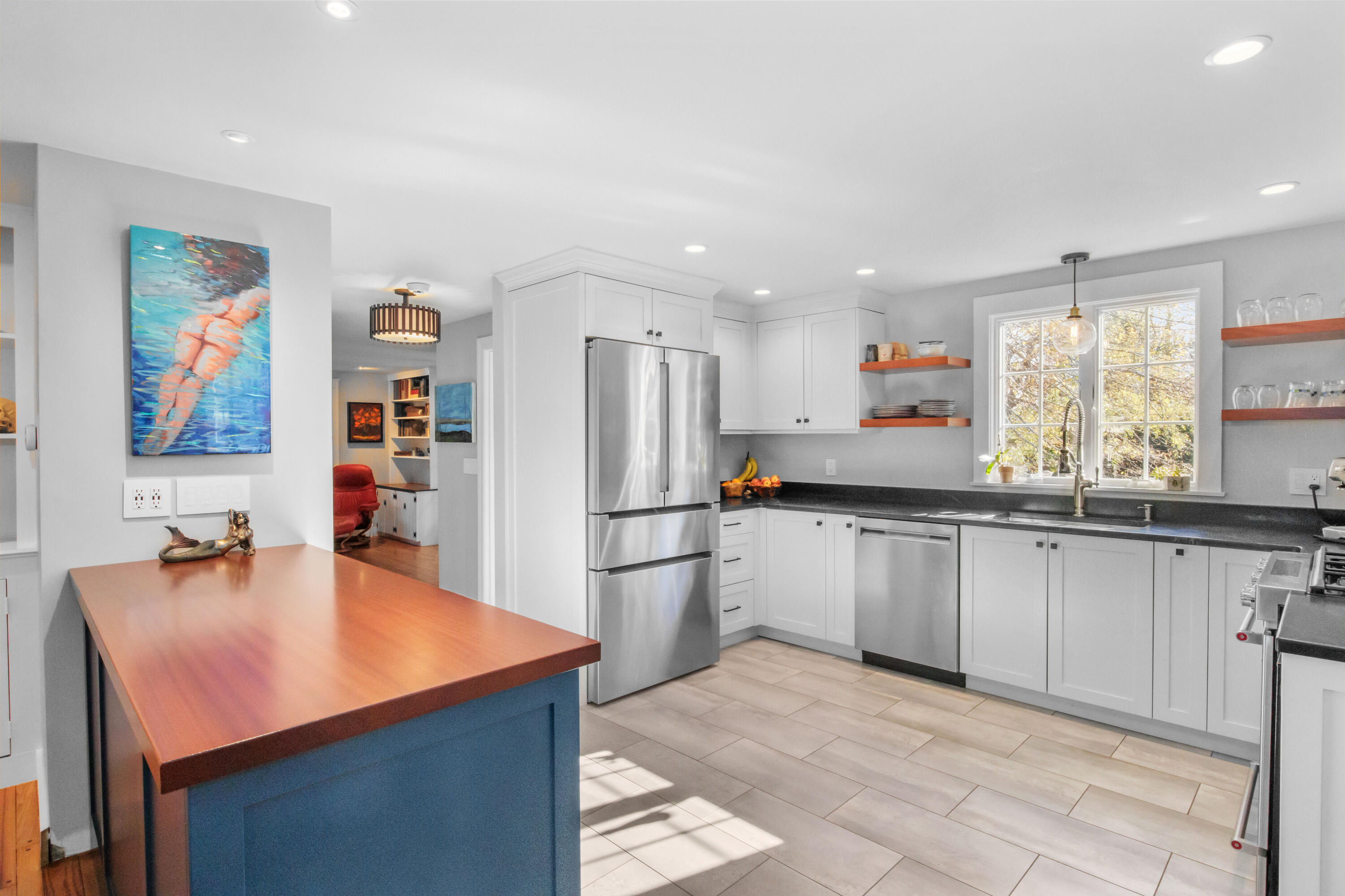 89 Namequoit Road Orleans, MA 02653 - Photo 5 of 42 a kitchen with stainless steel appliances granite countertop a sink refrigerator and cabinets