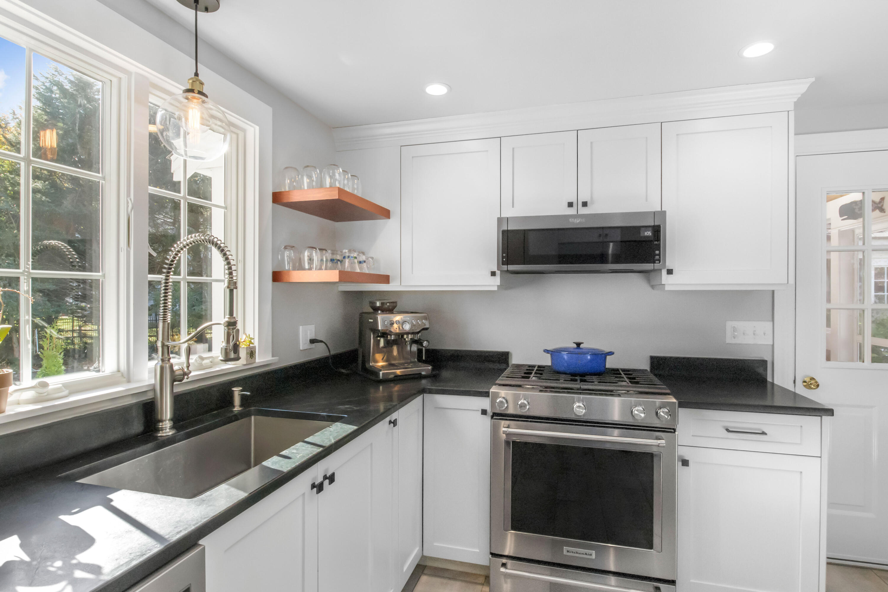 89 Namequoit Road Orleans, MA 02653 - Photo 6 of 42 a kitchen with stainless steel appliances a stove a sink and a microwave