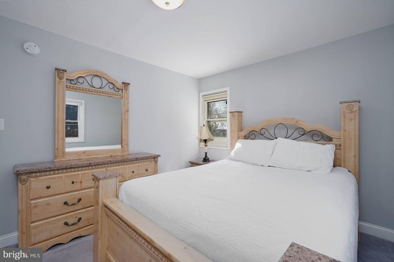 7719 Garrison Road Hyattsville, MD 20784 - Photo 11 of 23 a bedroom with a bed and a dresser