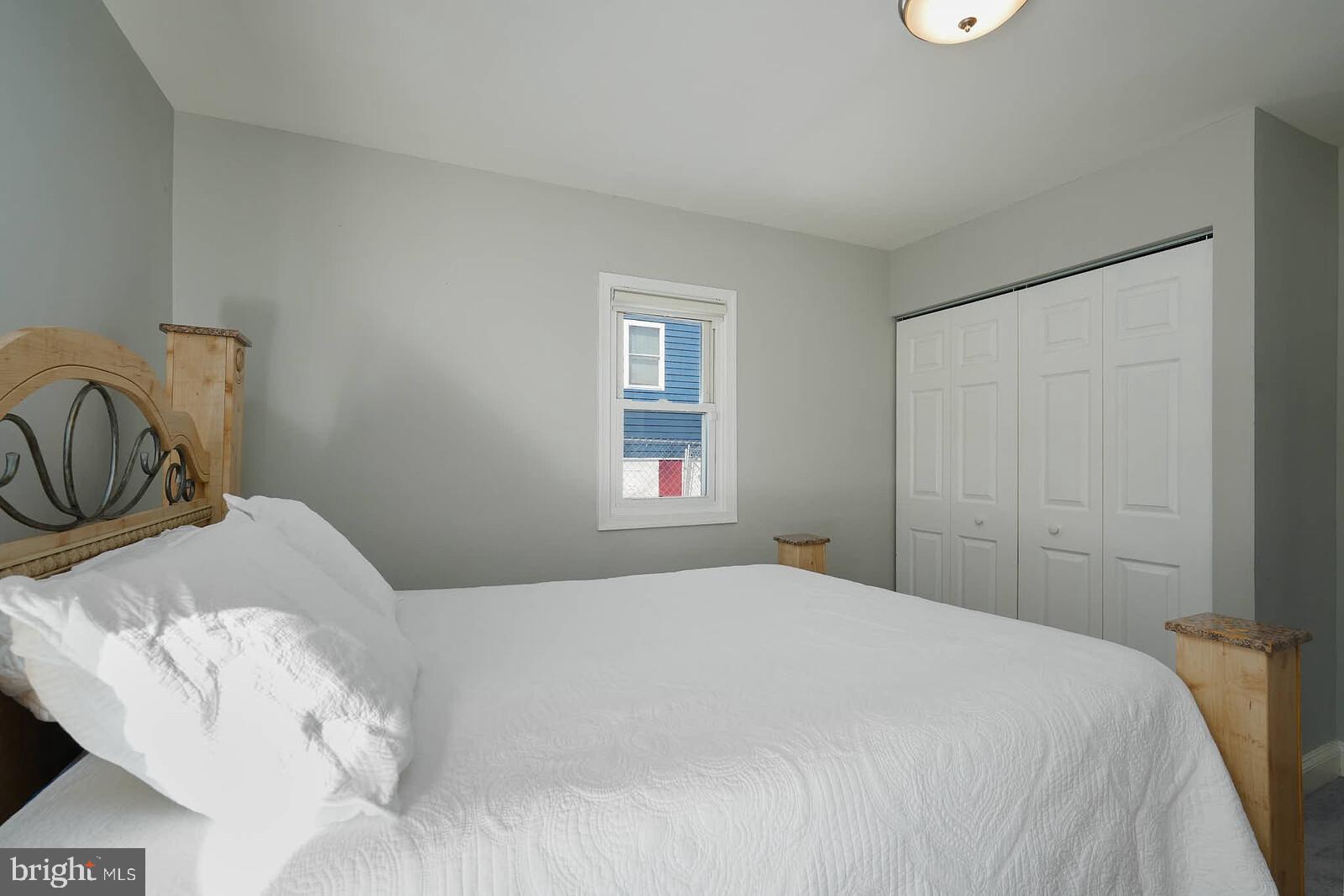 7719 Garrison Road Hyattsville, MD 20784 - Photo 12 of 23 a bedroom with a bed and a window