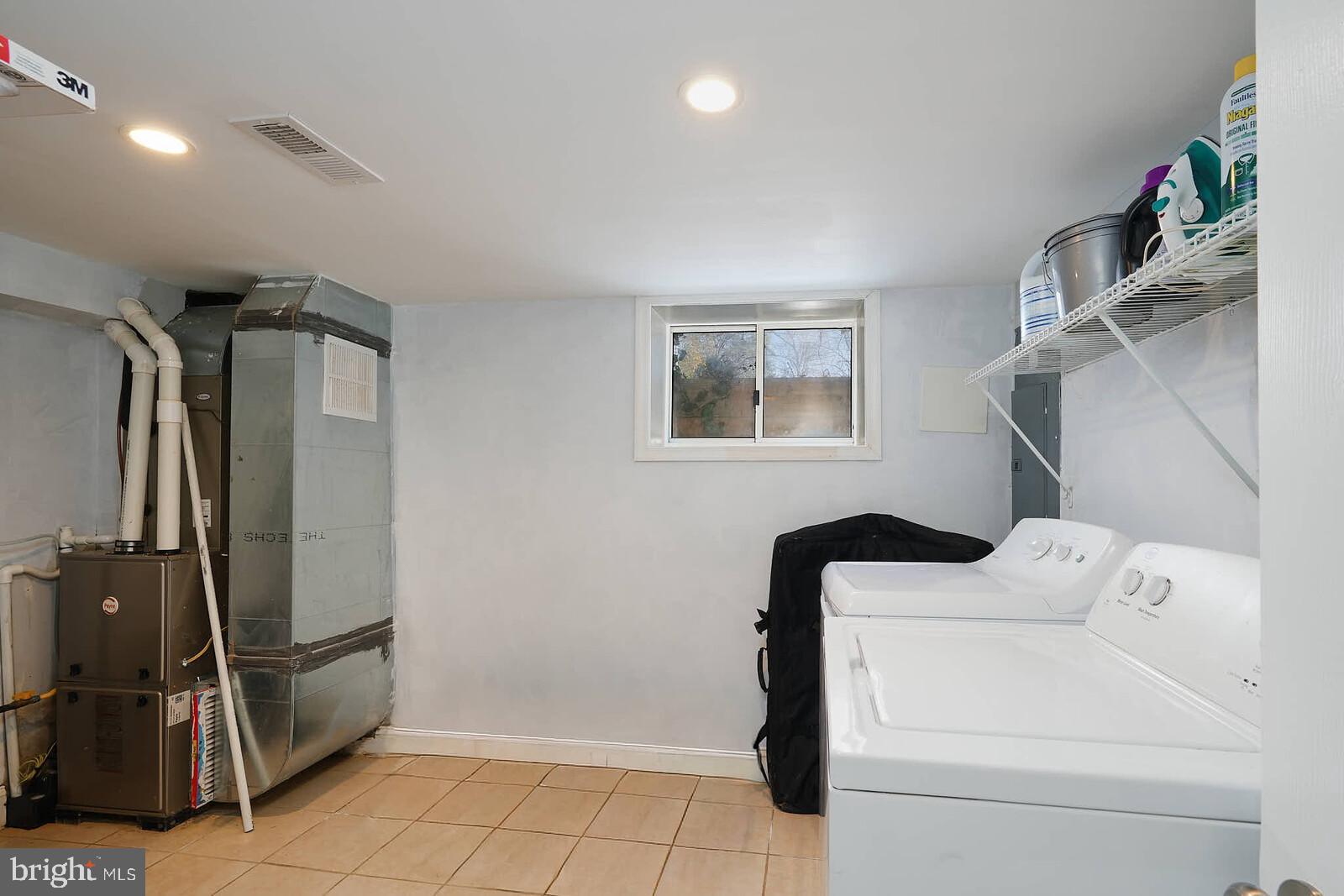 7719 Garrison Road Hyattsville, MD 20784 - Photo 20 of 23 a utility room with dryer and washer